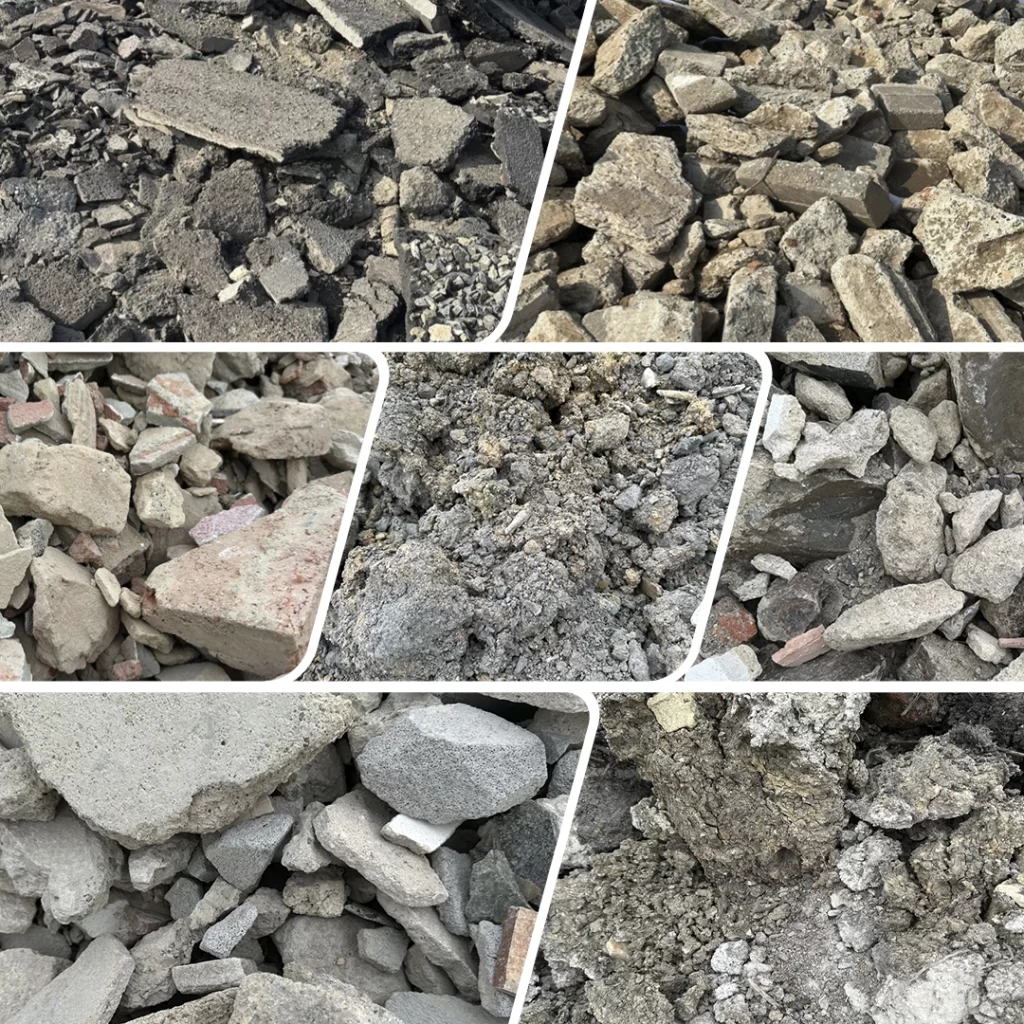 Různé typy stavební sutě a trosky, zahrnující rozbité betonové bloky, cihly a další stavební materiály.